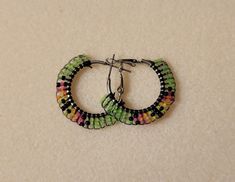 These mini Tribal earring hoops are made with artificial sinew and blacklight reactive glass beads. Color may vary slightly due to screen settings,  but each pair will be made custom with each order. Earring Hoops, Brick Stitch, Jewelry Earrings Hoops, Glass Beads, Hoop Earrings, Jewelry Earrings, Screen, Beads, Glass