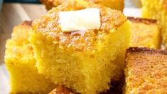 several pieces of cornbread with butter on top