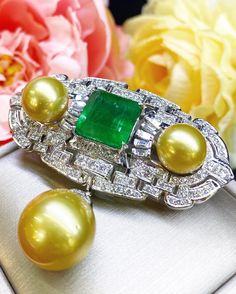 SPECTACULAR! ONE OF A KIND, ART DECO, HANDCRAFTED 18K WHITE GOLD PENDANT/BROOCH, FEATURING AN ENORMOUS 11.32 CARATS ZAMBIAN, CLASSIC EMERALD-CUT EMERALD AND TOP GRADE, SPARKLING, NATURAL, UNTREATED DIAMONDS! WITH HUGE 15 mm GOLDEN SOUTH SEA PEARL & 2 pieces of 12 mm Golden South Sea Pearls! Set in 18K solid white gold brooch! EMERALD: Weight: 11.32 carats! Vivid sweet green, with great transparency. SI1 clarity emerald. Few internal imperfections, visible but not noticeable when worn. Natura Luxury Platinum Jewelry With 17 Jewels, Luxury Platinum White Gold Jewelry, Luxury White Gold Platinum Jewelry, Exquisite Platinum Pendant Jewelry, White Gold Pendant With 17 Jewels, Luxury Diamond Brooch Jewelry, Platinum Pendant Jewelry For Formal Occasions, Luxury Diamond Brooch, Luxury Green Brooch Jewelry