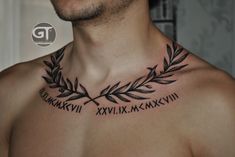 a man's chest with roman numerals and an olive branch on it