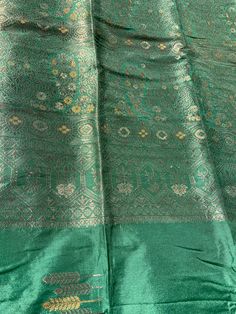 Handmade Dola Silk Saree Dark Sea Grean Color with Gold and Silver Zari works Party Green Dola Silk Saree, Celebration Green Saree With Motifs, Green Traditional Wear With Patterns For Celebration, Bohemian Green Blouse Piece With Zari Weaving, Green Traditional Wear With Traditional Patterns For Celebration, Green Bohemian Blouse Piece With Zari Weaving, Festival Green Blouse Piece With Weaving Work, Traditional Green Blouse With Weaving Work, Traditional Green Blouse Piece With Weaving Work