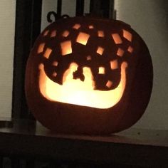 a carved pumpkin sitting on top of a table