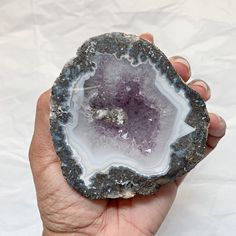 a person holding a large piece of rock in their hand