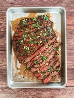 the steak has been cooked and garnished with green onions on top, along with some seasoning