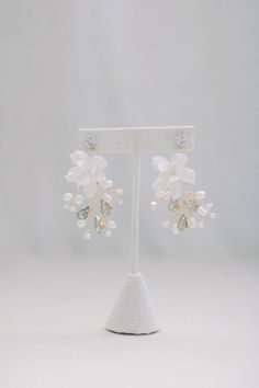 Beautifully handcrafted elegant earrings Pearl White Flower-shaped Wedding Earrings, Delicate White Flower-shaped Bridal Earrings, Formal White Flower-shaped Pearl Earrings, White Flower-shaped Crystal Earrings For Wedding, Luxury White Flower-shaped Pearl Earrings, Vine Earrings, Floral Collection, Clay Flower, Fresh Water Pearls