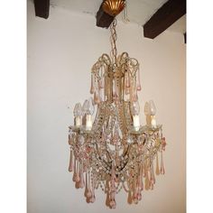 a chandelier hanging from the ceiling in a room