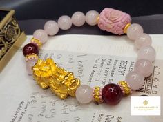 Gift yourself or your loveonce this beautiful Pure Gold Pixiu Bracelet.  *Materials: Au999 Pure Gold, Jade, Dragon Vein Agate,  Chinese Knot, and  Rose Quartz. *Karat: 24K Pure Gold  *Gold Color: Yellow *Gold Weight: Approximately 3.80g SIZE Pixiu Length:  32.2mm/1.26 Inches Stone: Approxiately 10mm 🔸️Pink jade represents love and harmony. It promotes growth, foster understanding, and deepen relationships. 🔸️Pi Xiu has the meaning of bringing in wealth and treasure. Of course, it is capable of Piyao Bracelet, Lunar Festival, Feng Shui Bracelet, Pixiu Bracelet, Bracelet Materials, Pink Jade, Jade Dragon, Chinese Jewelry, Dragon Vein Agate