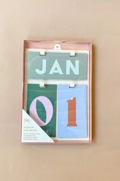 a set of three magnets with the words jan on them in different colors and shapes