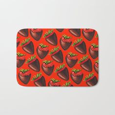 strawberries and chocolate on an orange background bath mat