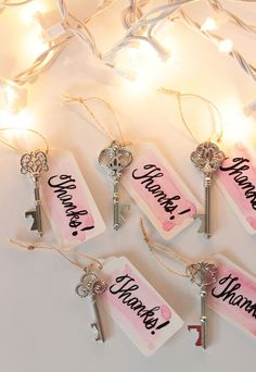 four key tags with the words change, choose, and arrange hanging from string lights