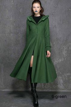 "This stunning long wool coat for womens is beautifully fitted and tailored for a classic, feminine design. It features navy blue, a slim fitting bodice with elongated sleeves and tapered waist band leading into a long, flowing skirt, shoulders and sleeve cuffs have a pretty ruffle detailing that really sets it apart. and thee hooded design will keep you warm and cozy, Lined in imitated silk, this coat also has deep side pockets and a three, fabric-covered button closure, we can custom made this Womens Coats Winter, Mod Clothing, Fit And Flare Coat, Coat For Winter, Womens Coats, Long Wool Coat, Wool Clothing, Half Skirt, Perfect Strangers