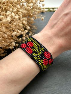 This black bead bracelet with a red viburnum ornament combines elegance and warmth. Wear this unique bracelet to express your style and add a mysterious and stylish accent to your look. Bracelet. Made of Czech beads Hypoallergenic clasp. Length 6,8 inches (17.cm) + Chain extension 2 inches (5cm). Taking the clasp into account. Width 1.1 inches (2.8 cm). Choker. Made from Czech beads. Hypoallergenic clasp. Length 12.5 inches (32 cm) + Chain extension 2 inches (5cm). Taking the clasp into account. Black Bead Bracelet, Bead Loom Bracelet, Red Beaded Bracelet, Ethno Style, Black Beaded Bracelets, Loom Bracelet, Bracelet Bead, Bead Loom Bracelets, Loom Bracelets