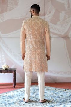 Ivory and beige sherwani with pearl and cutdana applique embroidery. Paired with a pant. - Aza Fashions Beige Kurta With Chikankari Embroidery For Reception, Beige Chikankari Embroidery Kurta For Reception, Beige Chikankari Kurta For Reception, Beige Sherwani With Dabka Work, Beige Sherwani With Chikankari Embroidery, Beige Sherwani With Dabka Work For Diwali, Beige Sherwani With Chikankari Embroidery For Diwali, Beige Straight Kurta Sherwani For Wedding, Beige Bandhgala With Naqshi For Reception