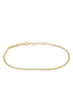 This 14-karat-gold bracelet features a slim curb chain centered by a single bezel-set diamond. 6" length; 1" extender; 1/8" setting diameter Lobster clasp closure Total diamond weight: 0.15ct. Color: F-G Clarity: SI1 14k gold/diamond Made in the USA >Diamond Guide Curb Chain Bracelet, Zoe Chicco, Diamond Guide, Bezel Set Diamond, Curb Chain, Bezel Setting, Womens Jewelry Bracelets, Chain Bracelet, Lobster Clasp