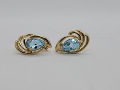 You are viewing a beautiful 14k solid gold topaz earrings. Pierced styleback. The total weight of the earrings approx.3.08 grams. Each earrings measures approx.17mm x 1mm wide. Marked 14k at the back. The earrings is in good condition. Blue Topaz Fine Jewelry Earrings For Formal Occasions, Formal Topaz Earrings, Modern Yellow Gold Jewelry With Blue Topaz, Yellow Gold Earrings With Blue Topaz Gemstone, Modern Yellow Gold Blue Topaz Jewelry, Formal Yellow Gold Topaz Earrings, Gold Oval Blue Topaz Earrings, Classic Topaz Earrings For Formal Occasions, Elegant Gold Earrings With Blue Topaz