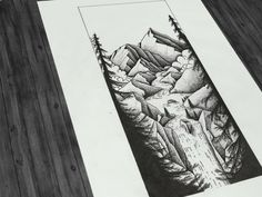 a pencil drawing of mountains and trees on paper