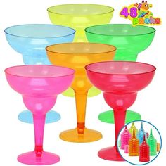 colorful plastic goblets are lined up with each other