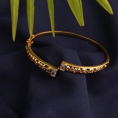 Description: Inspired by the rich tribal culture, this bangle by Tarinika is eclectic and has an earthy feel to it. It is gold plated with oxidized finish to give the definite earthy charm. Style with other jewelry from Maati Collection for a complete look. Details & Specifications: Materials used: Brass Alloy with Antique Gold Plating Weight -Bracelet:- 12 gm Length - Bracelet:- 6 cm Make it custom Want to make it a custom bracelet? Sure! Reach out to us at support@tarinika.com and we’ll be hap Gold Bracelet Simple, Antique Jewelry Indian, Indian Jewelry Sets, Bangles Jewelry Designs, Gold Bangles Design, Gold Jewelry Simple, Gold Bracelet For Women, Bangle Designs, Antique Necklace