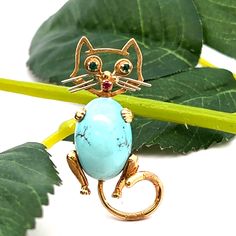 18K Yellow Gold Turquoise Emerald and Ruby Cat Brooch A perfect gift for your loved one for any special occasion or holiday!  Total weight: 7.78g Brooch Length: 39.41mm Brooch Width: 19.96mm Gemstone: Ruby, Emerald and Turquoise  Item will be placed into a gift box. * Turquoise Cabochon Brooch As A Gift, Turquoise Cabochon Brooch For Gift, Turquoise Brooch Jewelry Gift, Ruby Emerald, Cat Brooch, Cat Pin, Pin Brooch, Brooch Pin, Brooches