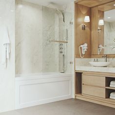 a bathroom with a sink, mirror and bathtub