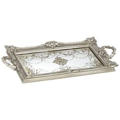 a silver tray with ornate designs on it