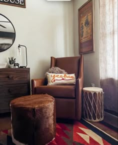 a brown chair and ottoman in a room