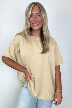 Details: Complete your casual look with our Raw Edge Jersey Short Sleeve Top. The solid jersey material and cut edge detailing give it a unique touch. Perfect for any occasion, this top offers comfort and style in one. (Seriously, it's a must-have for your wardrobe.) - Short sleeves - Relaxed fit - Raw edgeContent: 65% Polyester 35% cotton Size + Fit: Model is 5'4" and 5'2" wearing a Small - Approximate measurements from a size small - Full length: 27”- Chest: 54”- Waist: 54”- Sleeves: 12” Brand: Bibi Soft-washed Relaxed Tops For Casual Wear, Relaxed Soft-washed Tops For Casual Gatherings, Oversized Basic Solid Color Top, Basic Oversized Solid Color Top, Effortless Soft-washed Crew Neck Top, Beige Solid Color Crew Neck T-shirt, Beige Crew Neck T-shirt Solid Color, Casual Plain Tops For Layering, Beige Crew Neck T-shirt