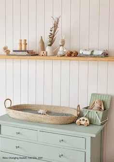 a baby's crib in the corner of a room next to a shelf