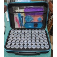 an open blue case filled with lots of different types of toothbrushes and other items