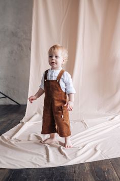 Designer corduroy brown jumpsuit for a boy. There are pockets. Fastens with buttons. Convenient style. Does not restrict movement, does not press. Great for delicate baby skin. Indispensable on a birthday or other holiday. Baby Boy Overalls Outfit Fall, Brown Courderoy Overalls, Brown Corduroy Overalls With Pockets, Brown Overalls, Toddler Boy Overalls, Little Boy Corduroy Pants, Brown Jumpsuit, Brown Overalls Baby Boy, Baby Boy Fall Outfits