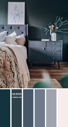 a bedroom with dark green walls and white bedding, gray furniture, and grey rugs