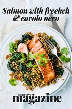 salmon and spinach on a white plate with a fork next to the cover of magazine