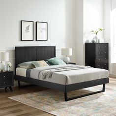 a bed room with a neatly made bed and two nightstands