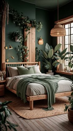 a bedroom with green walls, plants and a bed in the middle is pictured here