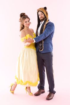 a man and woman dressed up as beast and snow white in costume for a photo shoot