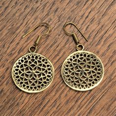 Intricate and timeless, these mandala disc drop earrings feature a unique pattern of overlapping circles forming a fine seed of life detail. Charming, elegant and perfect for day or night wear. ⚬ Drop 4cm ⚬ Hook Closure ⚬ Weight 3g (each) ⚬ Recycled Pure Brass ⚬ Nickel Free and Hypoallergenic ⚬ Handcrafted by Artisans in Pushkar, India ⚬ Sold as a Pair ♡ Treat yourself or gift that special someone. Each pair comes perfectly packaged in a charming OMishka branded pouch. Have a question? Please message me ♡ Brass Round Flower Earrings, Seed Of Life Mandala, Handmade Pouch, Mandala Circle, Overlapping Circles, Seed Of Life, Gem Earrings, Night Wear, Brass Jewelry