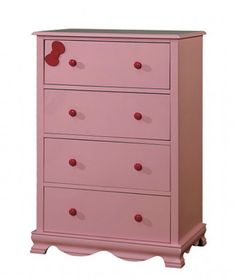 a pink chest of drawers with red knobs