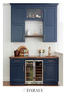 an image of a kitchen with blue cabinets