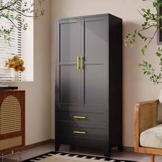 a tall black cabinet with gold handles in a living room next to a chair and potted plant