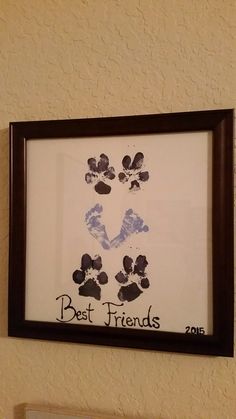 a dog paw print hanging on the wall next to a sign that says best friends