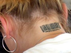 a woman with a barcode tattoo on her neck