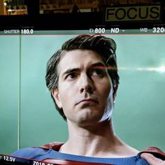 a television screen with a man in superman costume on it's face and the words focus above his head