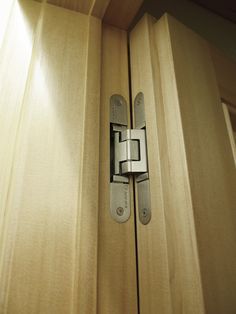 a close up of a wooden door with a latch