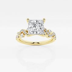 a yellow gold engagement ring with a princess cut diamond in the center and side stones