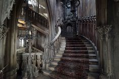 an old building with stairs leading up to the second floor