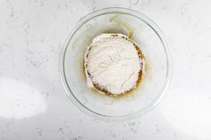 a bowl filled with food on top of a white counter