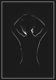 a black and white photo of a woman's back with her hands on her hips