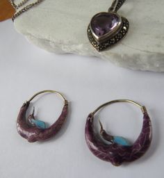 A gorgeous pair of cloisonne arched crane earrings in vermeil (gold wash), with purple and turquoise blue enamel. Probably early Laurel Burch earrings - if you know how to verify (or not), I'd love a convo! In good to very good condition - just gently used and loved - a few small deformities here and there but no loss of enamel or function. For items shipped to places outside of the US, buyers pay all costs related to the import of the items, including customs fees and taxes. Purple Metal Pierced Jewelry, Purple Pierced Metal Jewelry, Enamel Teardrop Jewelry With Matching Earrings, Antique Handmade Purple Jewelry, Vintage Enamel Gemstone Jewelry, Vintage Enamel Jewelry With Gemstone, Handmade Antique Purple Jewelry, Traditional Hallmarked Enamel Jewelry, Elegant Drop Earrings With Inlay