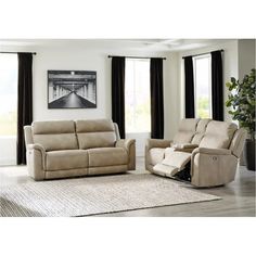 a living room with two recliners and a couch