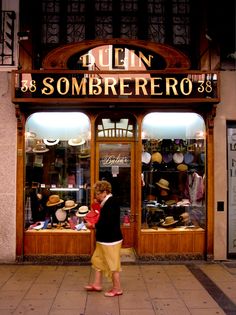 a woman standing in front of a store